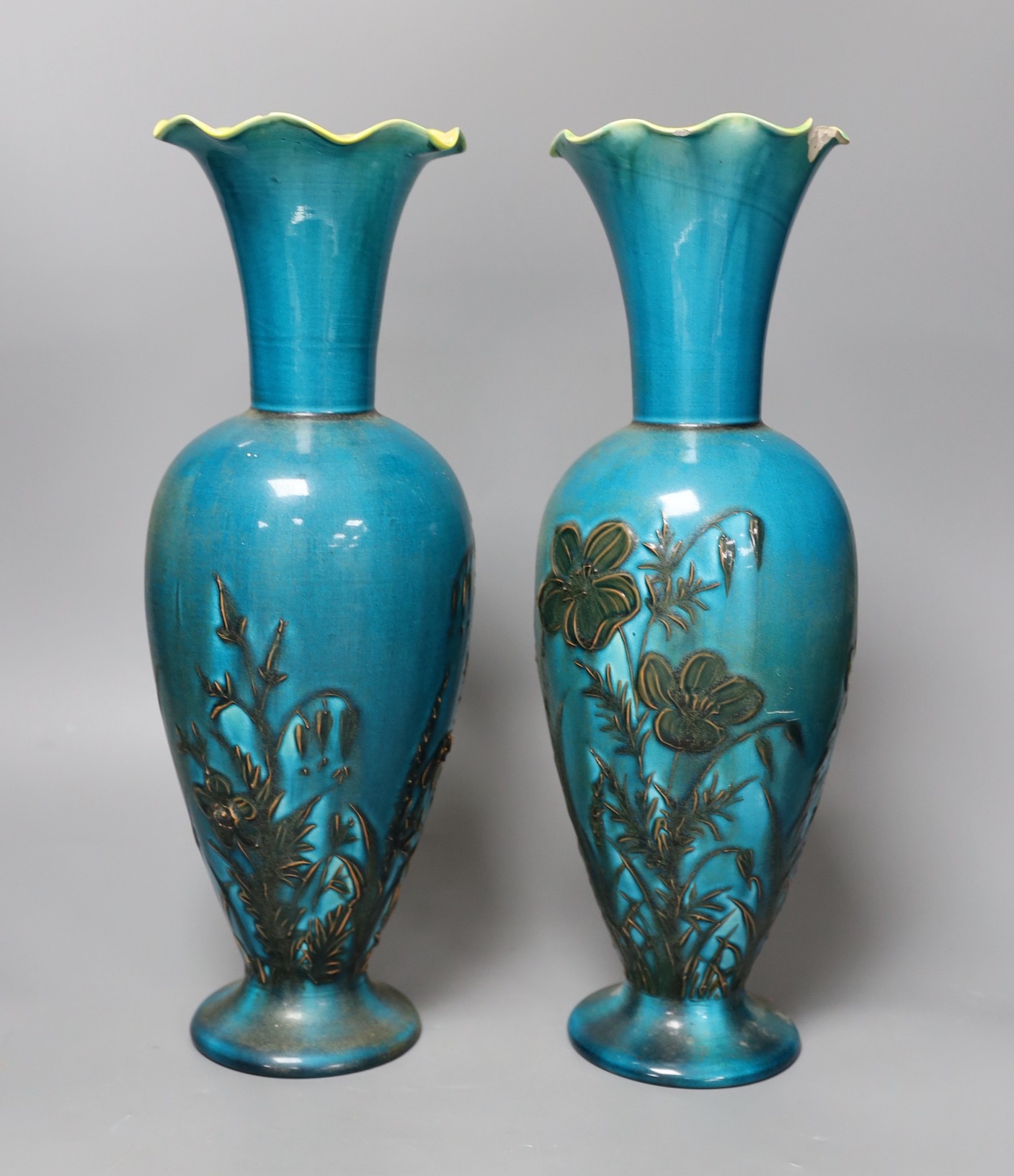A pair of Linthorpe turquoise glazed pottery vases, impressed model no 2219, incised mark AS. 36cm high